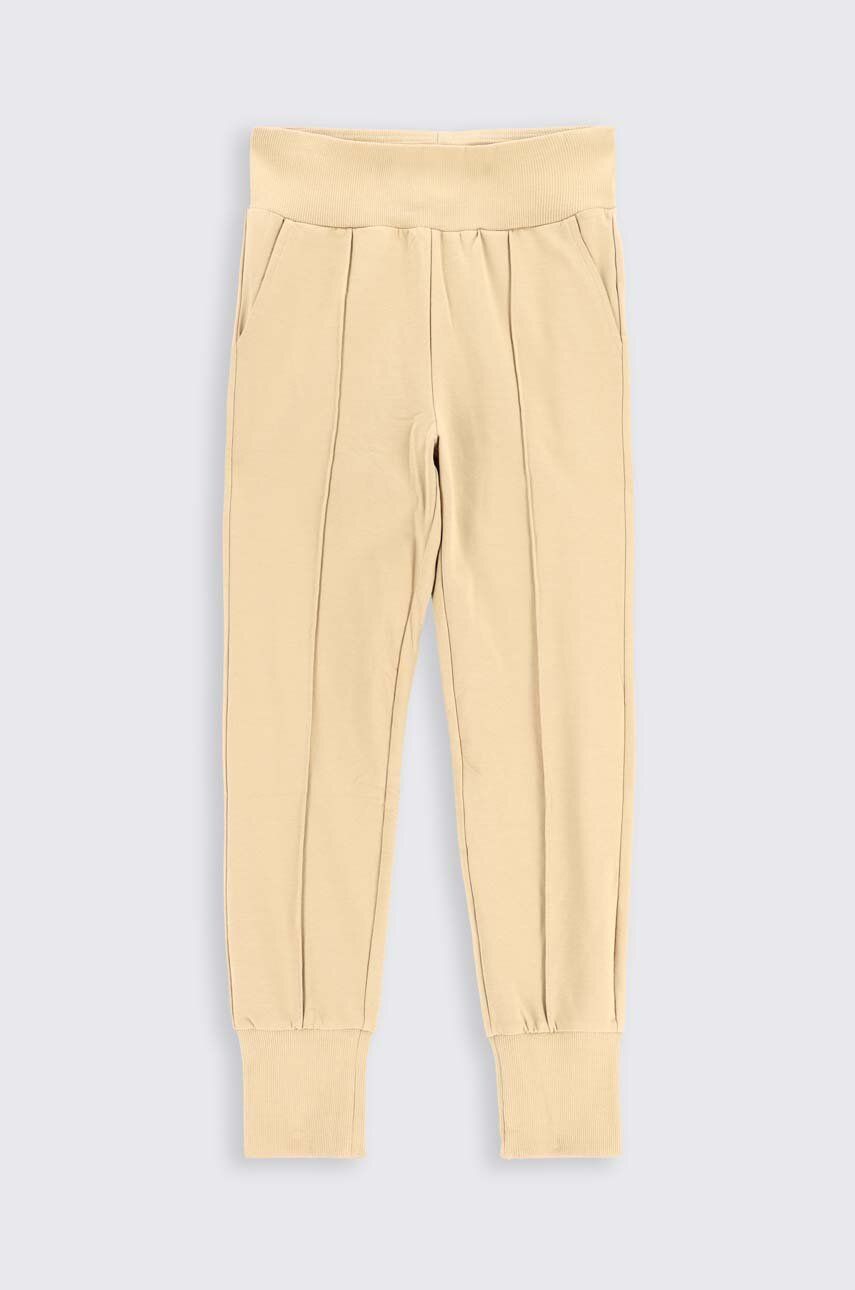 Coccodrillo spodnie dresowe bawełniane dziecięce kolor beżowy gładkie