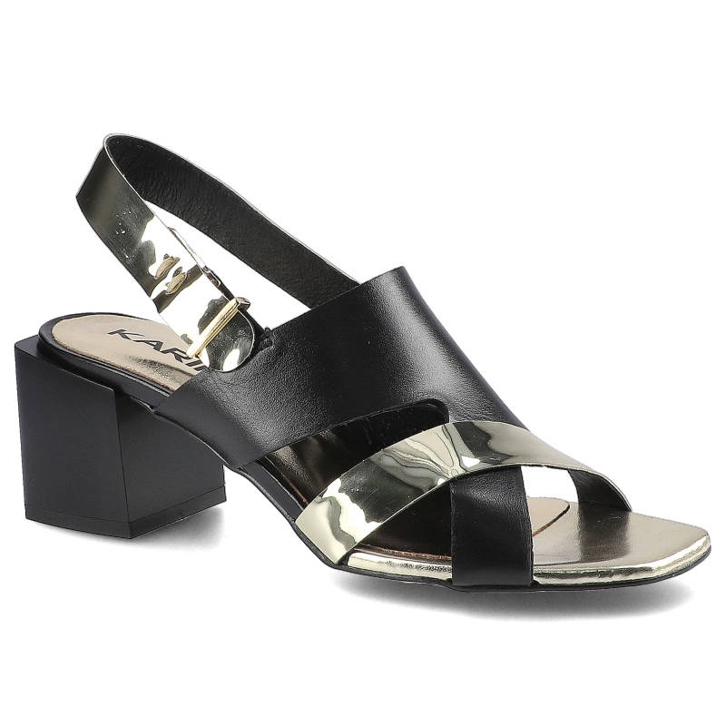 Sandaly damskie Karino, naturalna skóra licowa w czarnym kolorze z metaliczną wstawką na pasku z odkrytą piętą i stabilnym obcasem o geometrycznym ks