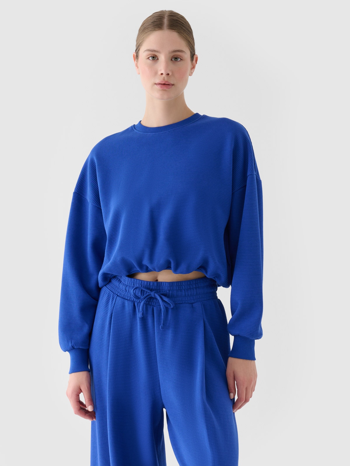 4F Bluza dresowa nierozpinana bez kaptura damska - niebieska XL