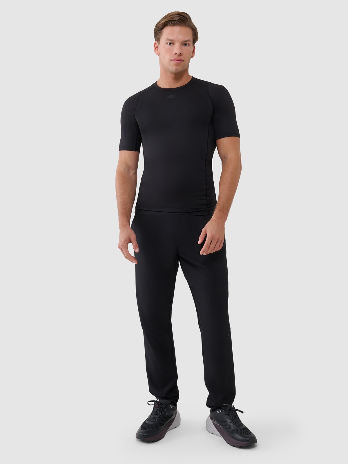 4F Spodnie treningowe szybkoschnące męskie - czarne XL