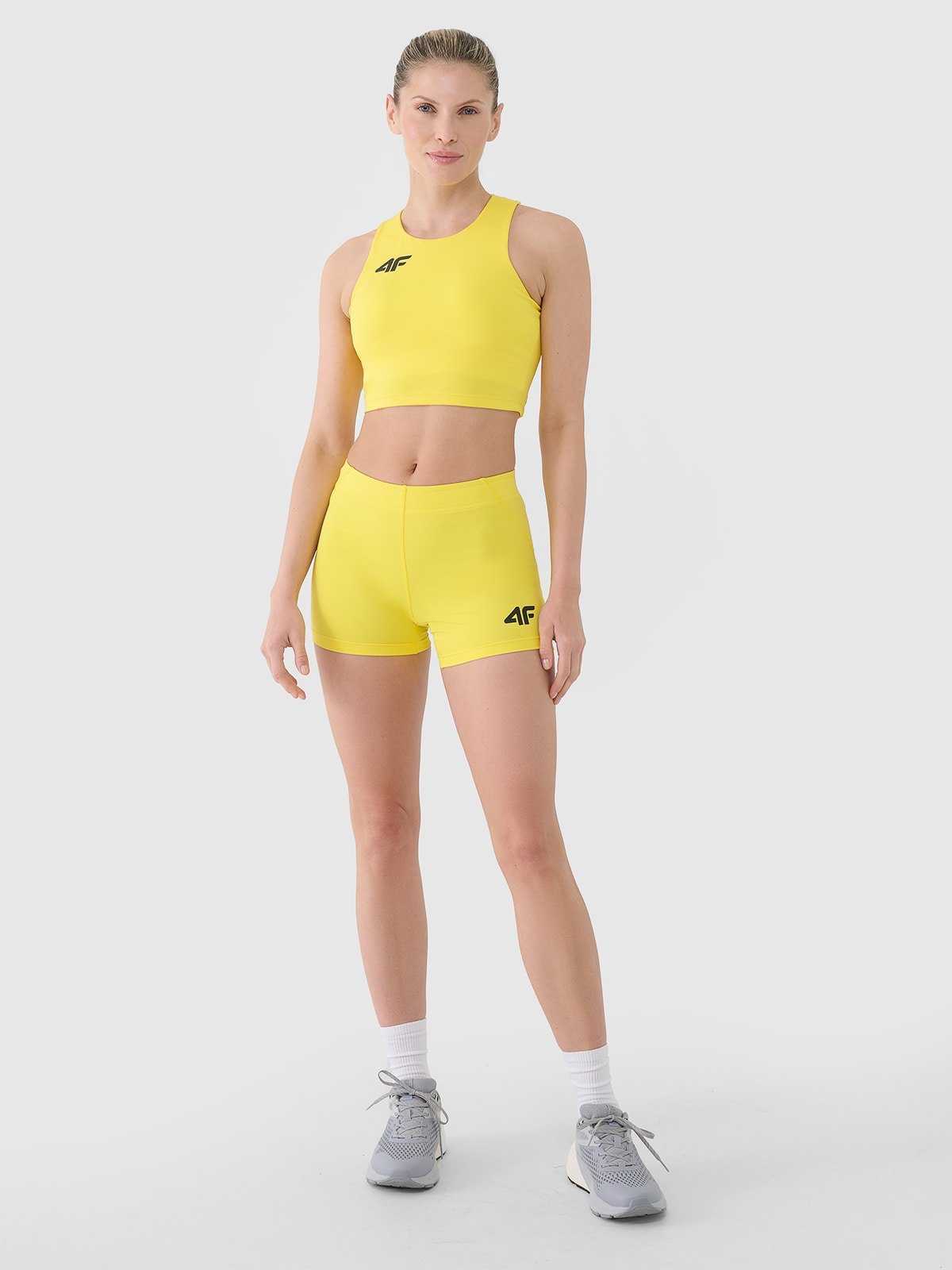 4F Legginsy krótkie treningowe damskie - żółte M