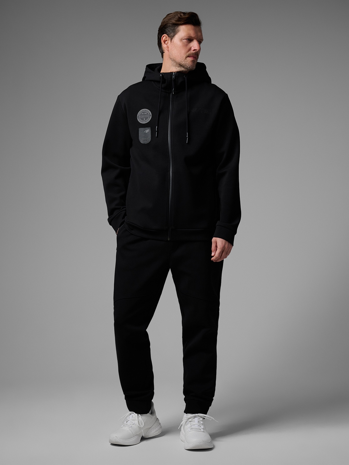 4F Spodnie dresowe joggery męskie 4F x Robert Lewandowski - czarne XL