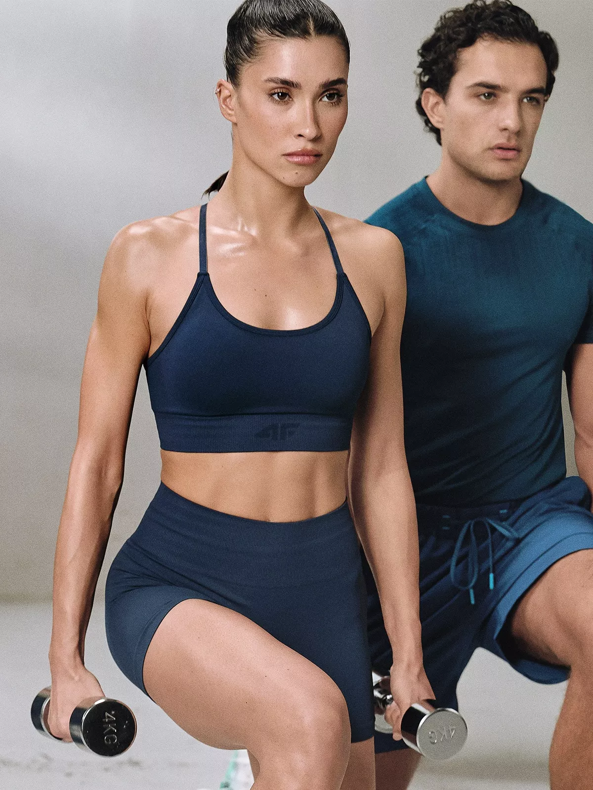 4F Biustonosz treningowy bezszwowy z niskim wsparciem damski - turkusowy M/L