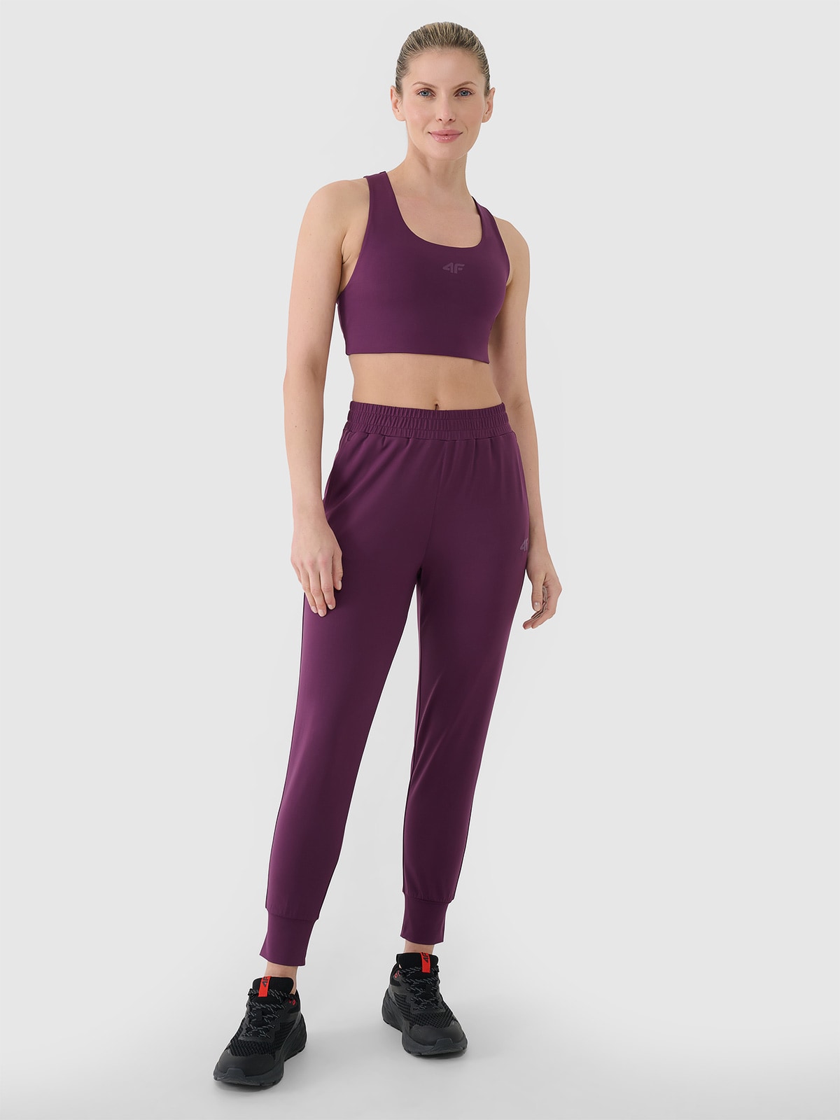4F Spodnie treningowe szybkoschnące damskie - fioletowe XS