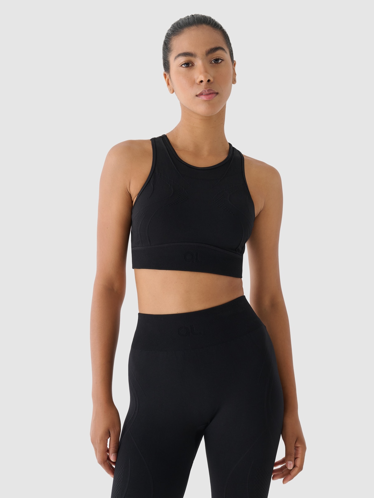 4F Biustonosz treningowy bezszwowy ze średnim wsparciem 4F x Anna Lewandowska - czarny S/M