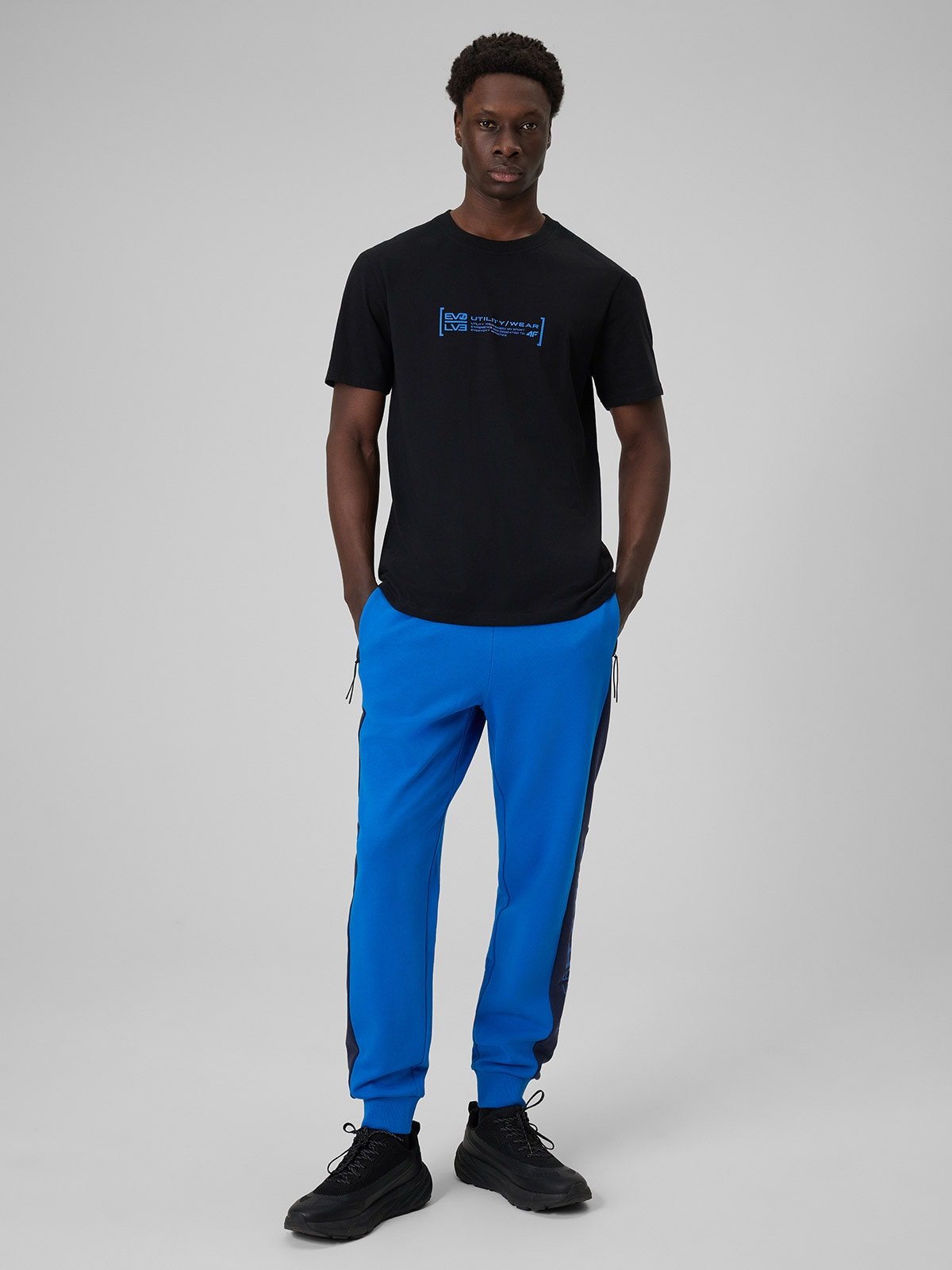 4F Spodnie dresowe joggery męskie - niebieskie L