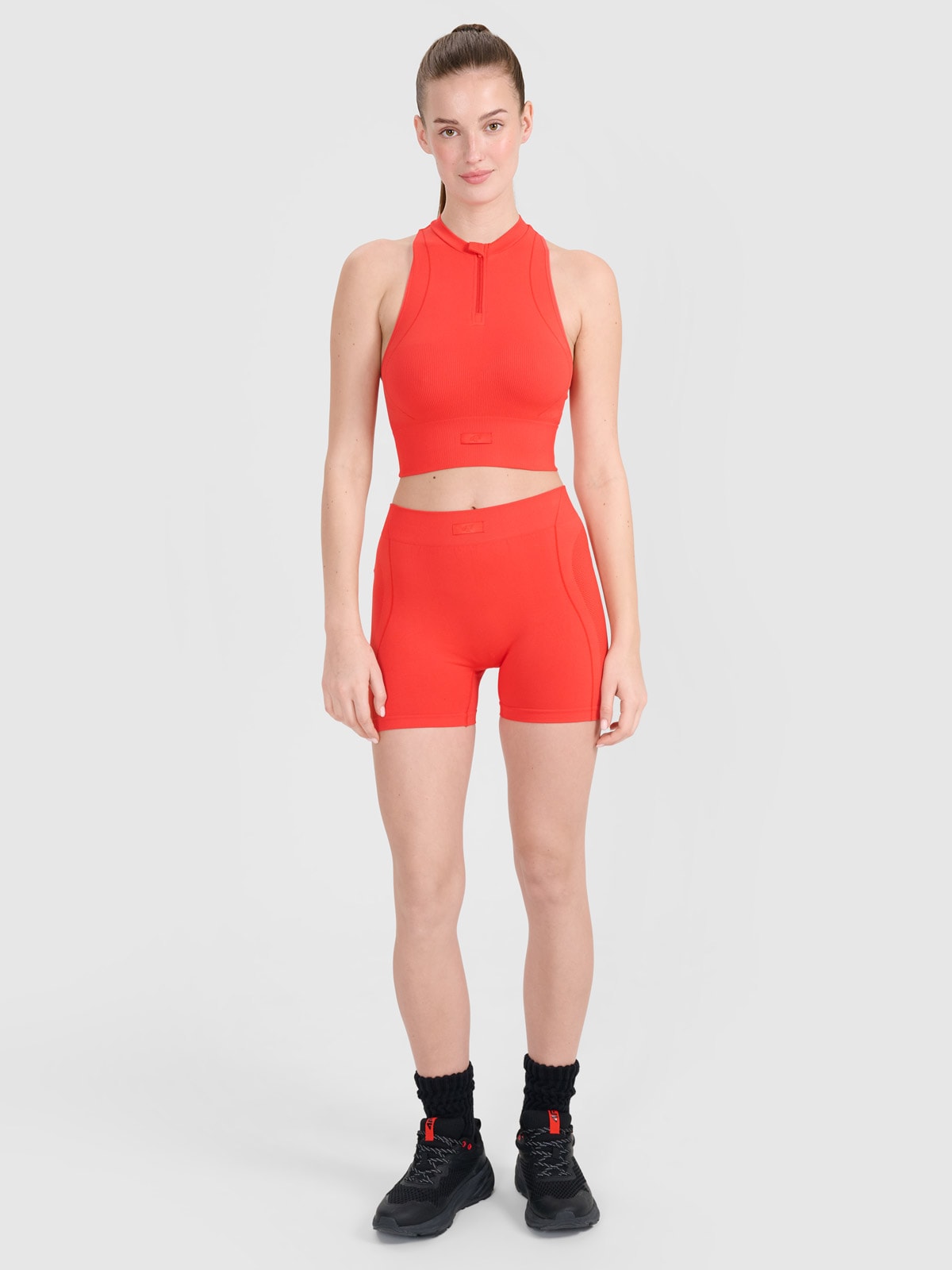 4F Legginsy krótkie bezszwowe treningowe damskie - czerwone M/L