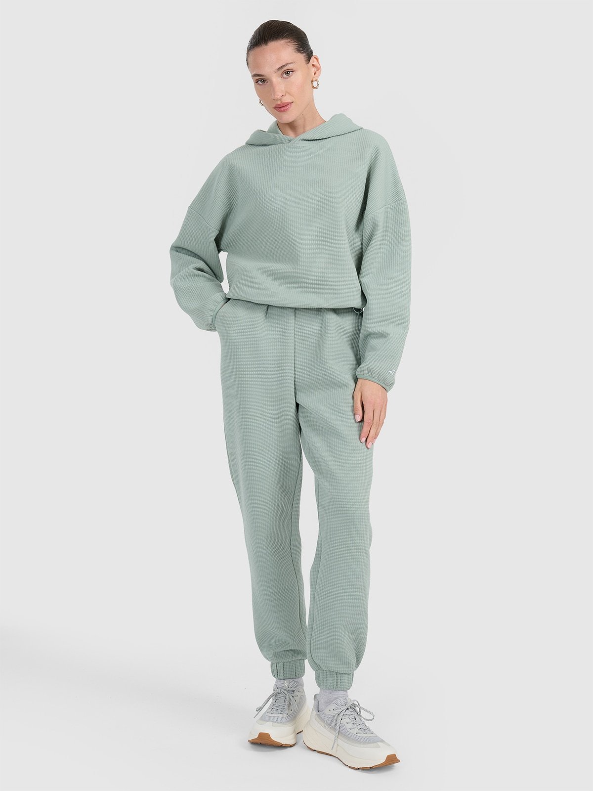 4F Spodnie dresowe z waflowej dzianiny damskie - turkusowe S
