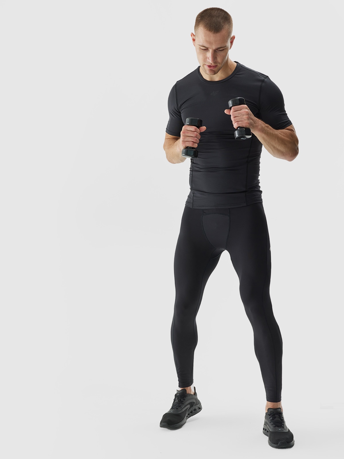4F Legginsy treningowe ze średnim stanem męskie - czarne M