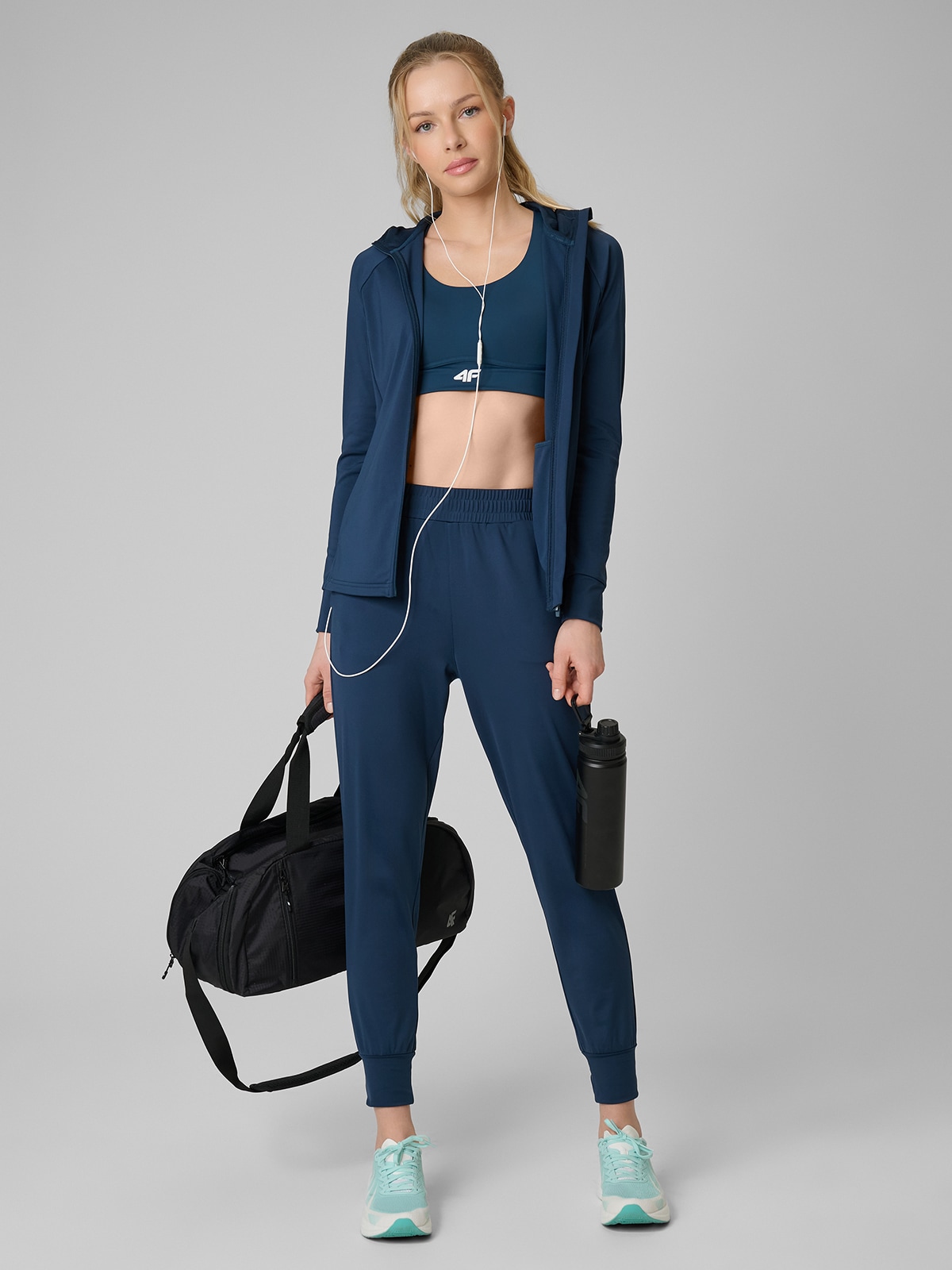 4F Spodnie treningowe szybkoschnące damskie - turkusowe XS