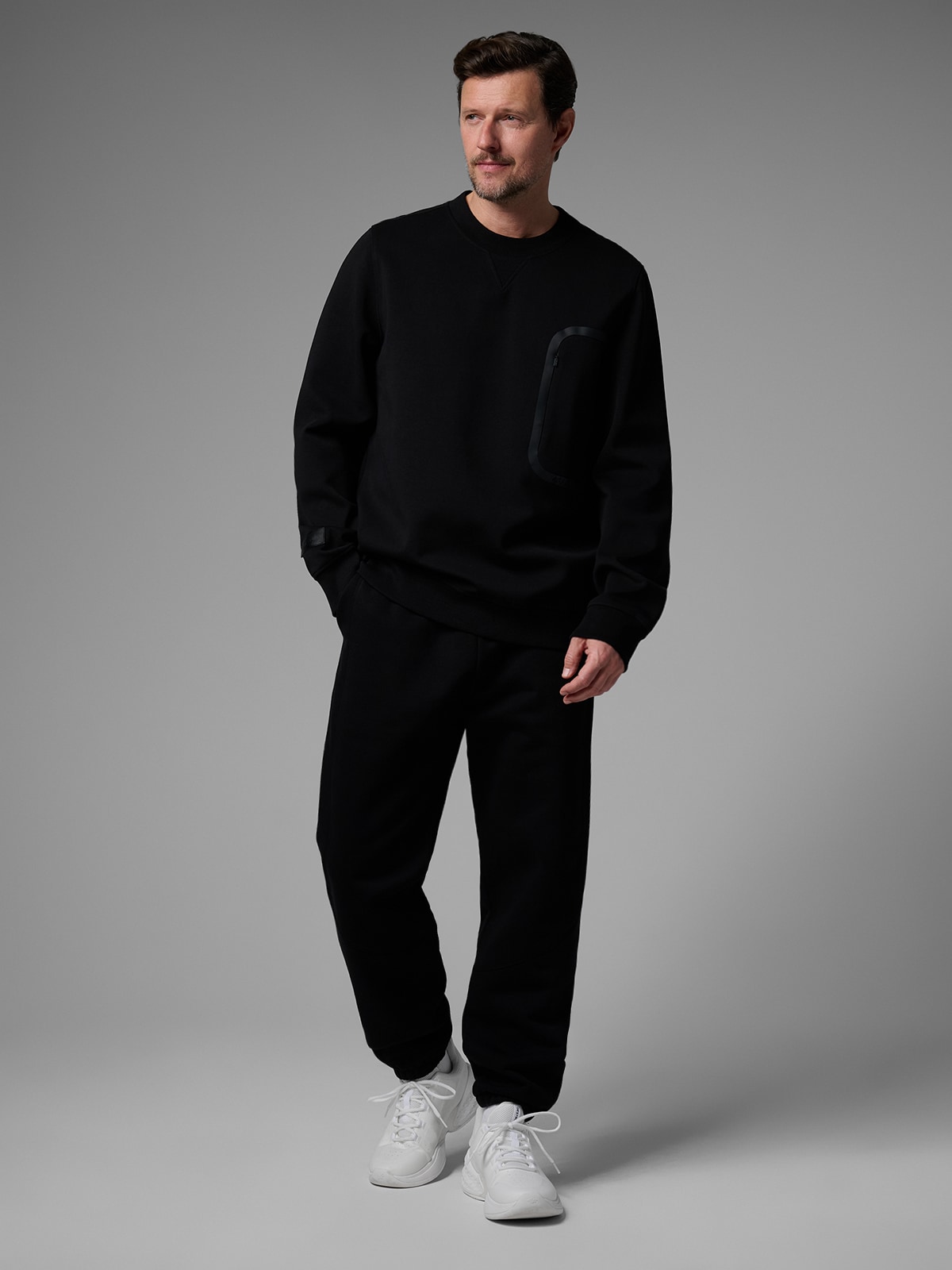 4F Spodnie dresowe joggery męskie 4F x Robert Lewandowski - czarne XL