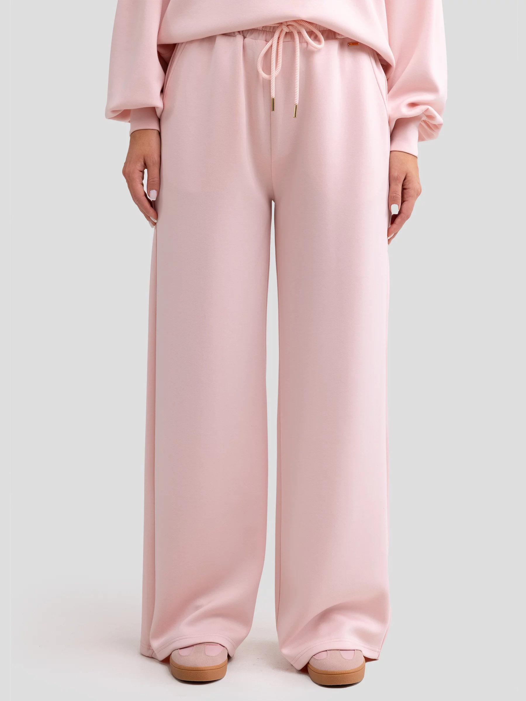 Spodnie damskie dresowe z szeroką nogawką jasnoróżowe Lunarap 600