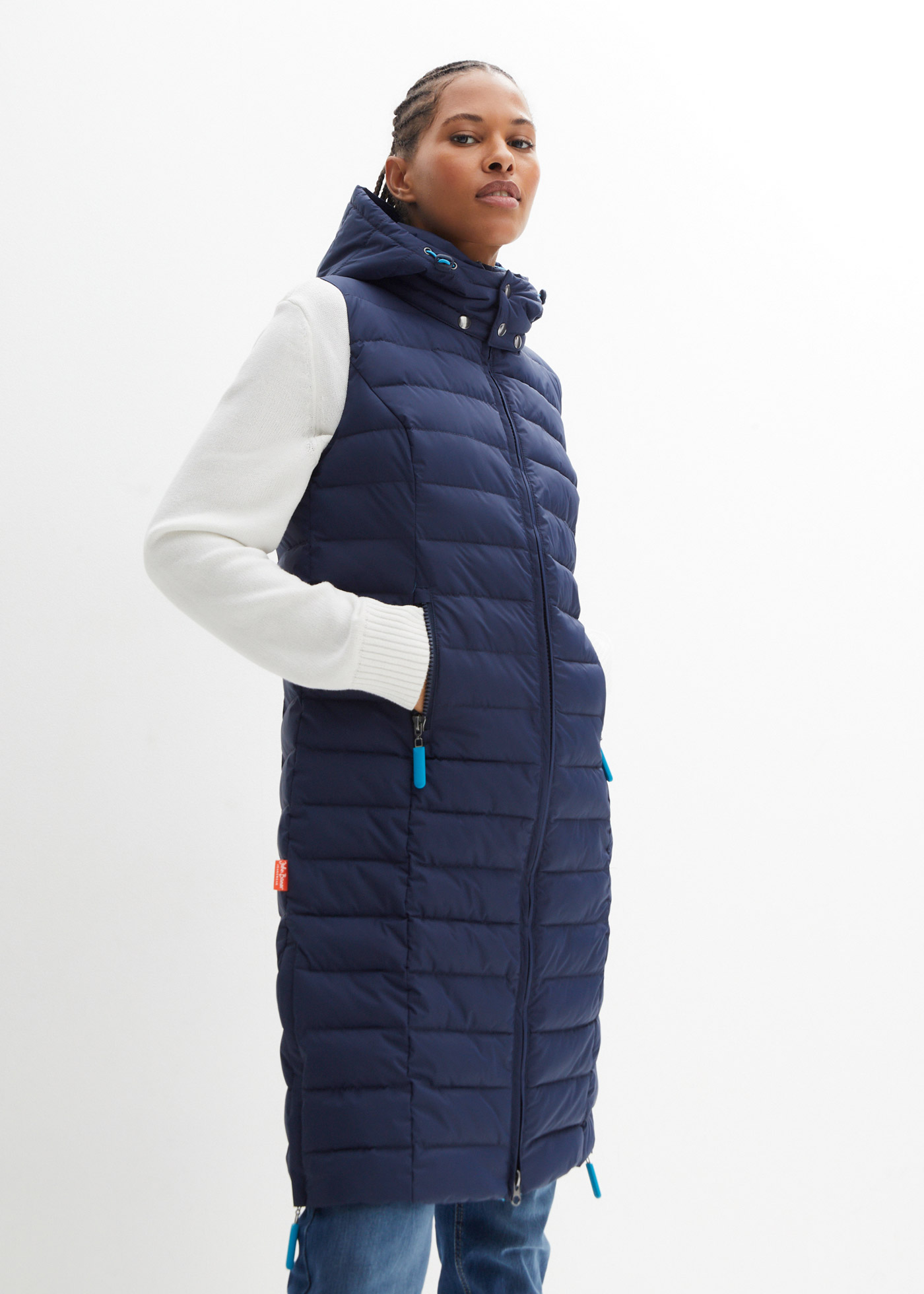 Wygodna długa kamizelka pikowana z kapturem i zamykanymi kieszeniami