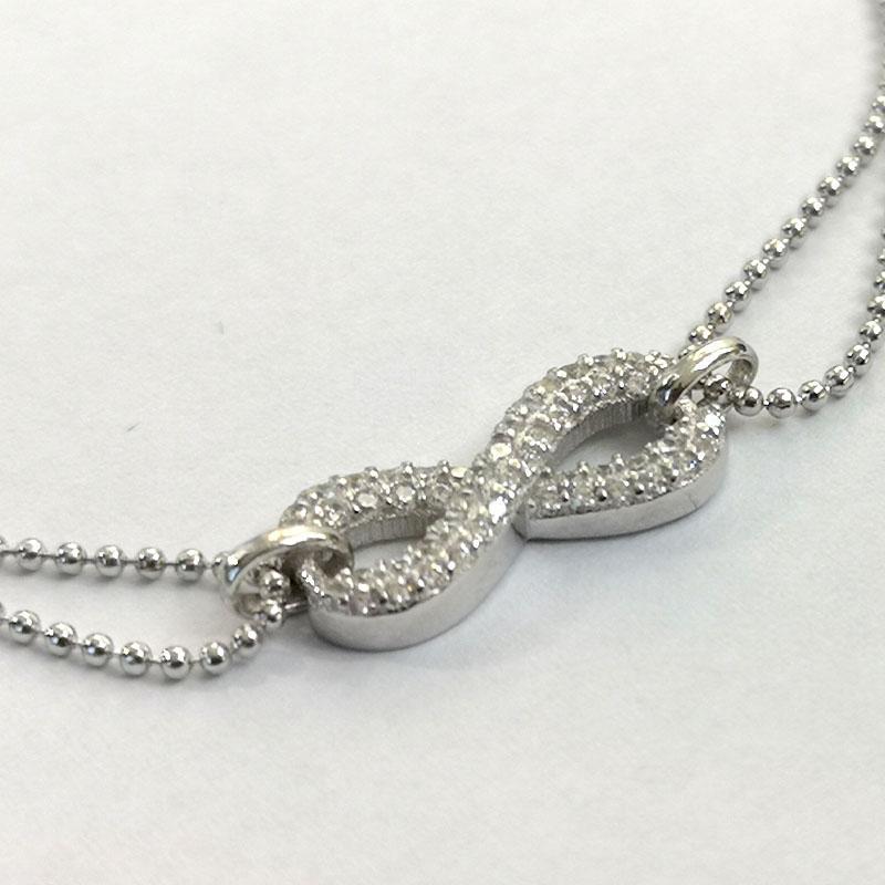 Srebro i Kamienie Srebrna bransoletka nieskończoność z cyrkoniami na podwójnym łańcuszku