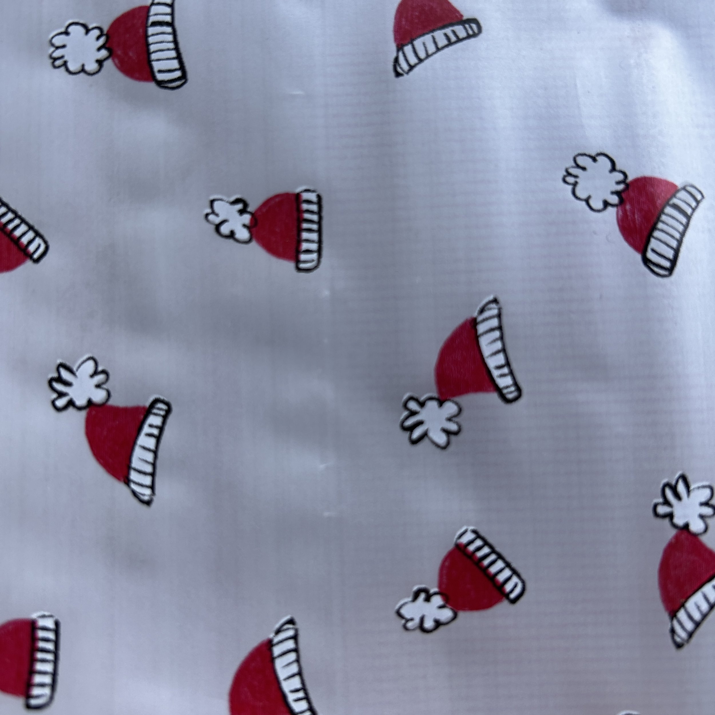 Folia świąteczna do pakowania biały czapeczka Mikołaja 70cmx2m 316m70