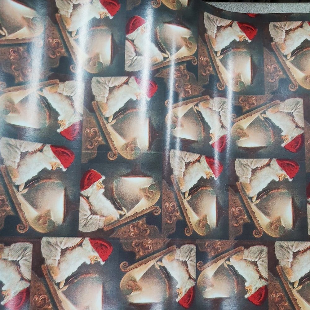 Papier świąteczny w Mikołaje 57cmx20m 20m143