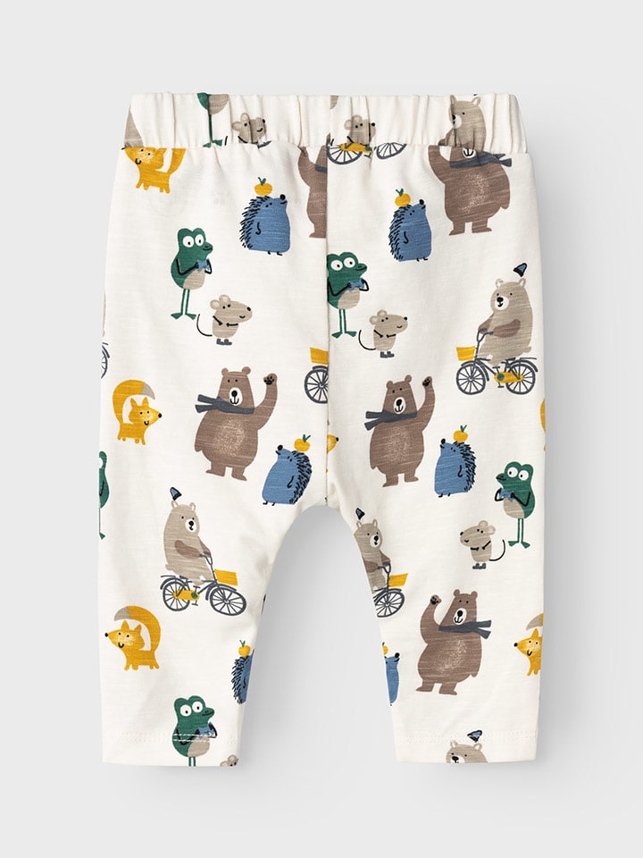 name it Spodnie dresowe "Levo" w kolorze kremowym ze wzorem rozmiar: 86