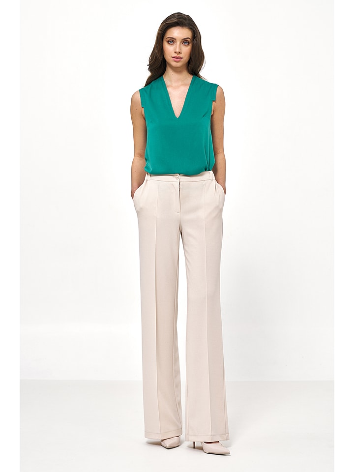 Nife Spodnie w kolorze beżowym rozmiar: 38