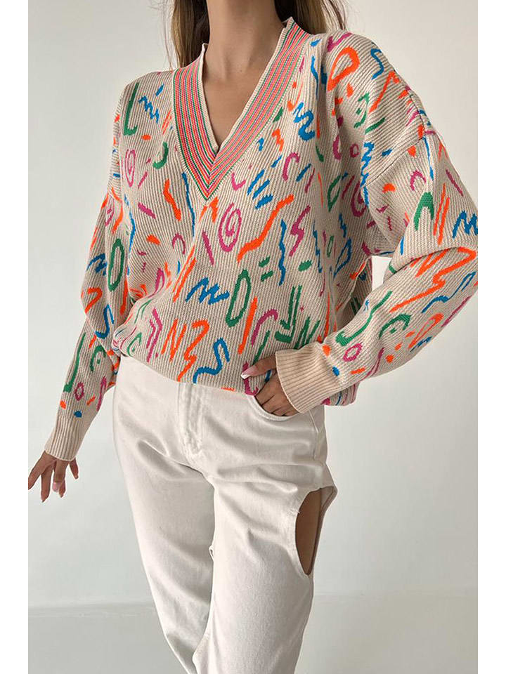 Sweter w kolorze beżowym ze wzorem
