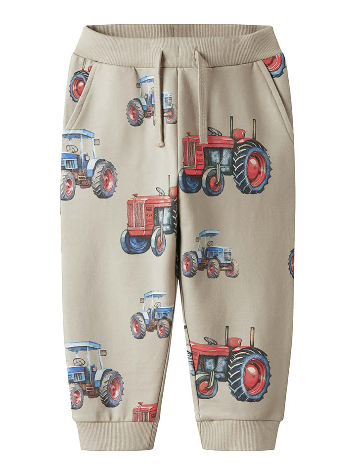 name it Spodnie dresowe w kolorze beżowym ze wzorem rozmiar: 128