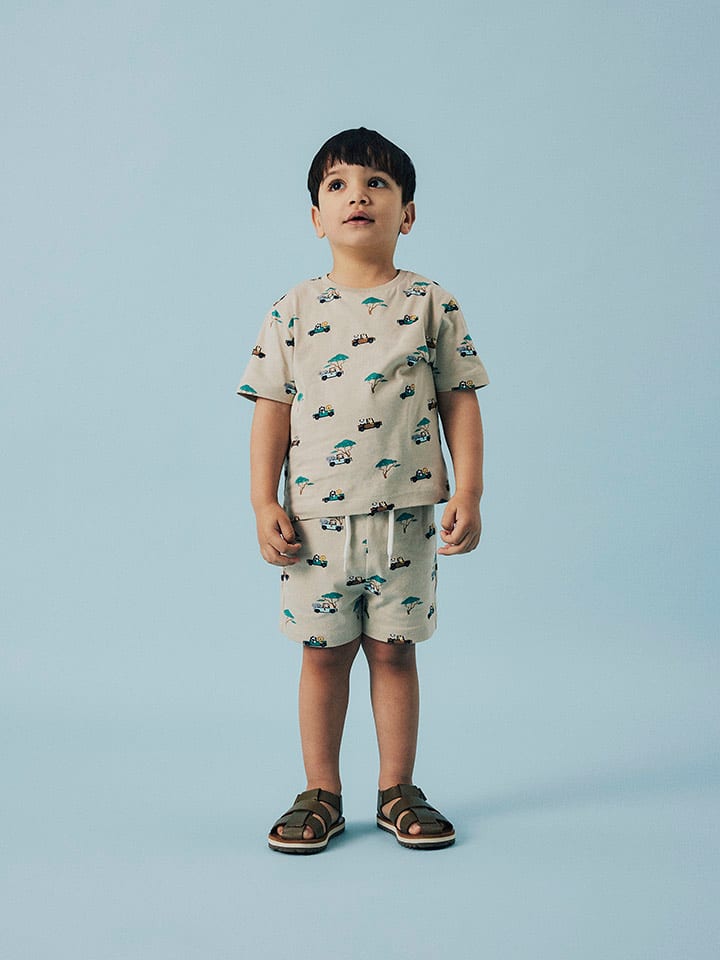 name it Koszulka "Jivan" w kolorze beżowo-turkusowym rozmiar: 98