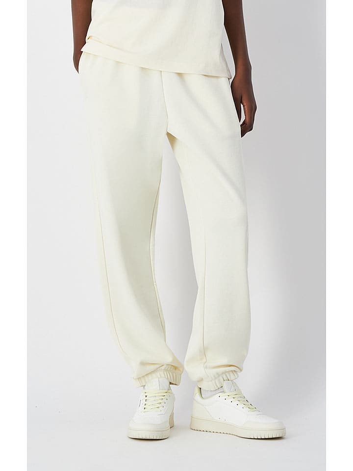 Champion Spodnie dresowe w kolorze kremowym rozmiar: XL