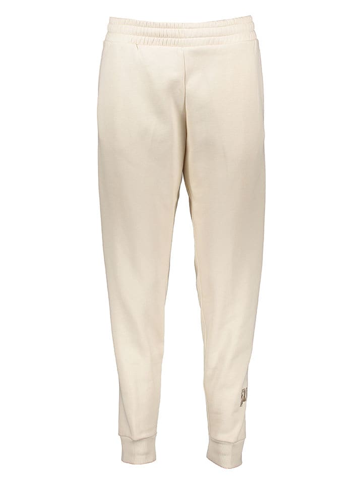 Puma Spodnie dresowe "Essentials+" w kolorze beżowym rozmiar: XL