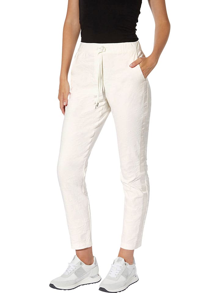 Heine Spodnie w kolorze kremowym rozmiar: 44