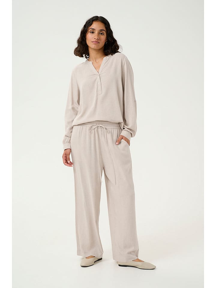 Kaffe Spodnie "Milia" w kolorze kremowym rozmiar: 36