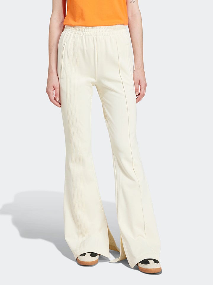 adidas Spodnie dresowe w kolorze kremowym rozmiar: XL