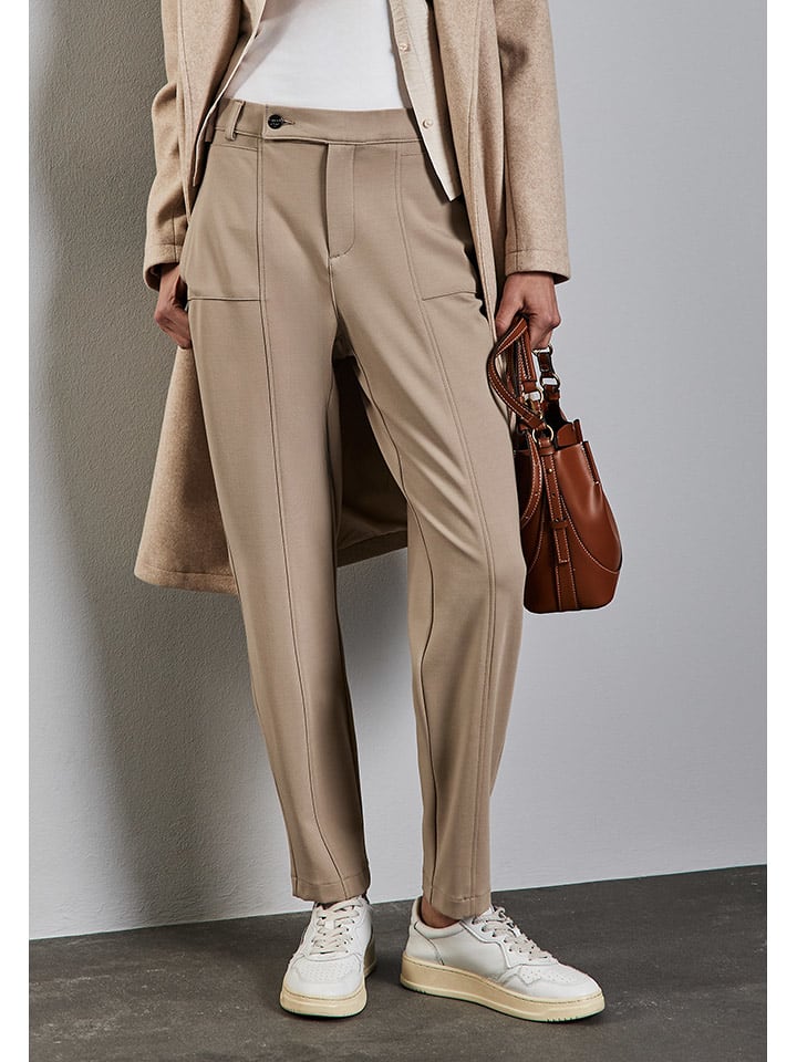 Street One Spodnie dresowe - Tapered fit - w kolorze beżowym rozmiar: 40/L28