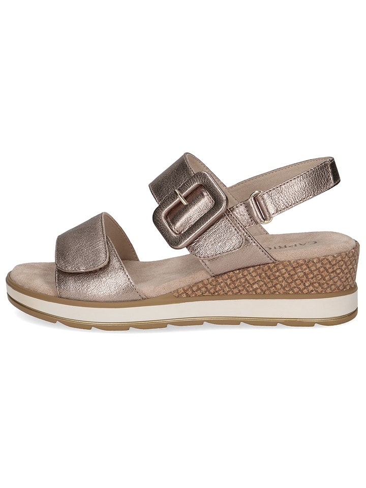 Caprice Skórzane sandały w kolorze złotym na koturnie rozmiar: 39