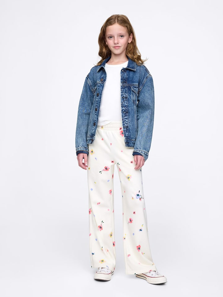 GAP Spodnie dresowe w kolorze kremowym rozmiar: 110