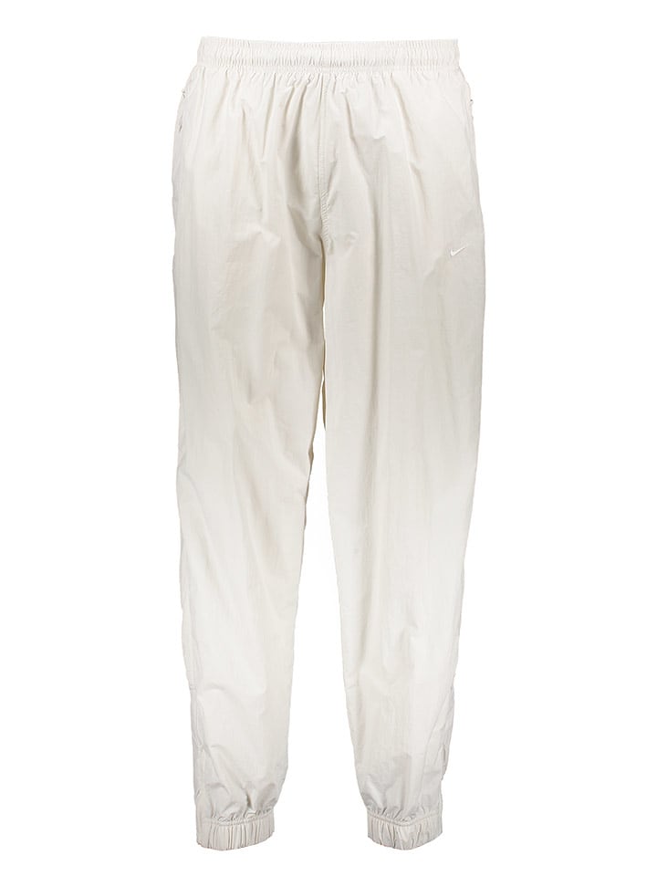 Nike Spodnie sportowe w kolorze kremowym rozmiar: M
