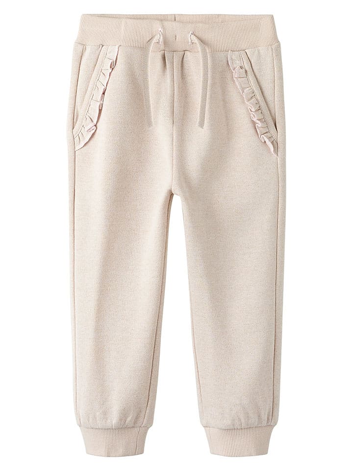name it Spodnie dresowe "Tilde" w kolorze beżowym rozmiar: 116