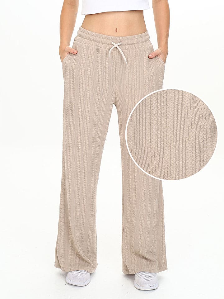 Denokids Spodnie dresowe w kolorze beżowym rozmiar: 122