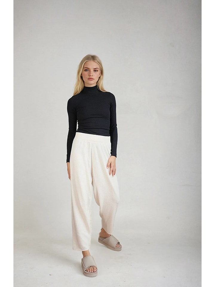 Monki Spodnie w kolorze kremowym rozmiar: L