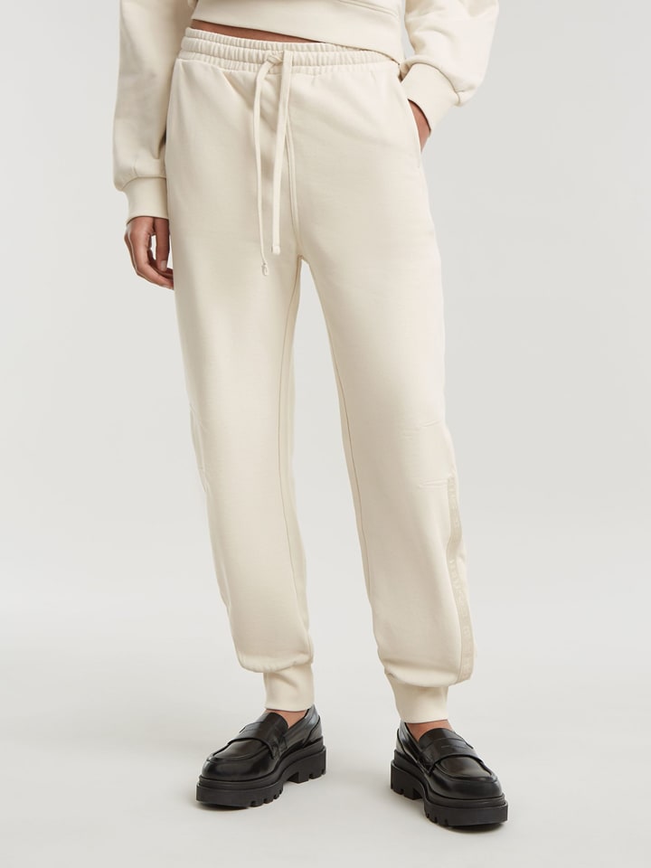 G-Star Spodnie dresowe w kolorze kremowym rozmiar: M