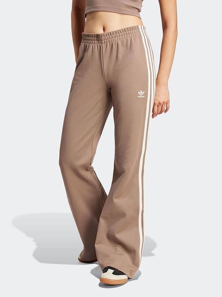 adidas Spodnie dresowe w kolorze beżowym rozmiar: M