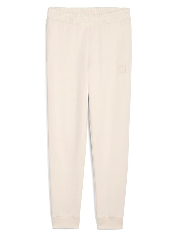 Puma Spodnie dresowe w kolorze kremowym rozmiar: S