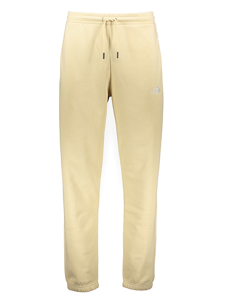 The North Face Spodnie dresowe "Essentials" w kolorze kremowym rozmiar: L