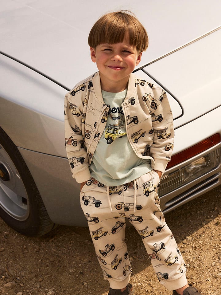 name it Spodnie dresowe "Hekar" w kolorze beżowym rozmiar: 92