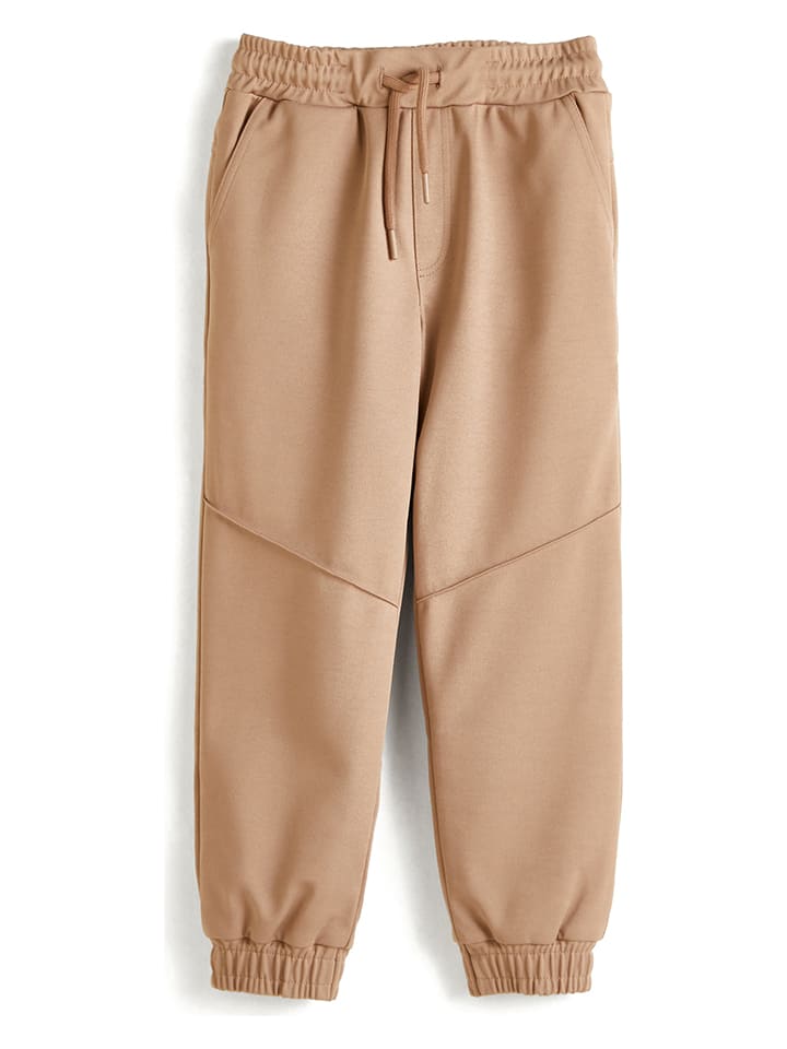 JAKO-O Spodnie funkcyjne w kolorze beżowym rozmiar: 140