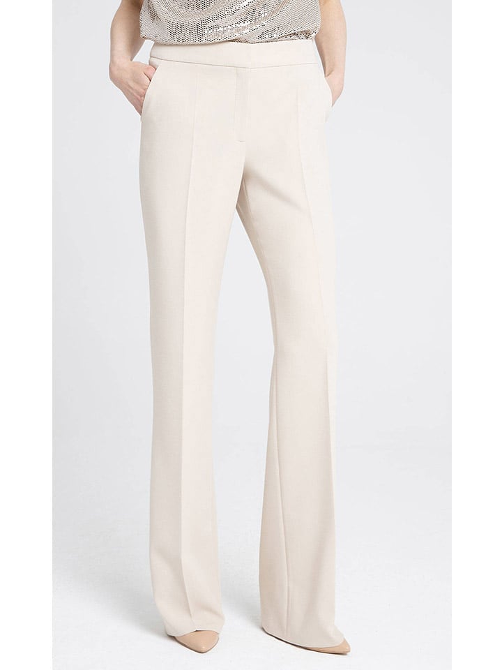 Deni Cler Spodnie w kolorze kremowym rozmiar: 36