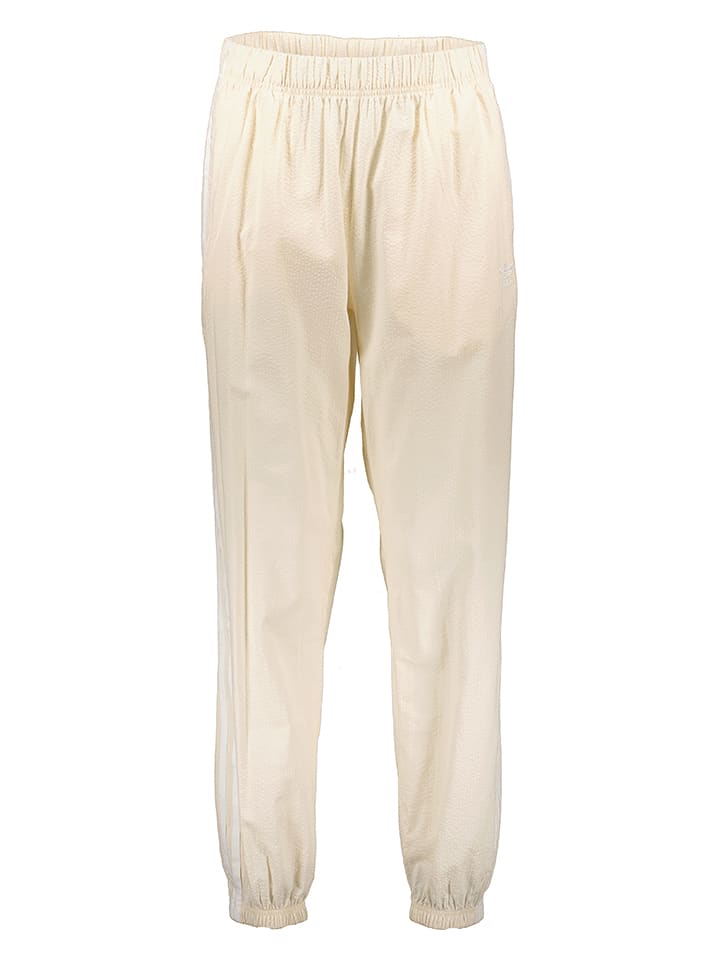 adidas Spodnie dresowe w kolorze beżowym rozmiar: 34